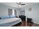 Calm bedroom with hardwood floors, dark furniture, and plenty of natural light at 54 Andora Ct, Kissimmee, FL 34758