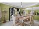 Dining room includes a bar area, chandelier, and ornamental decorations at 54 Andora Ct, Kissimmee, FL 34758