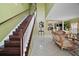This home's foyer features a grand staircase and lots of natural light at 54 Andora Ct, Kissimmee, FL 34758