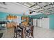Spacious garage area converted into a kitchen and dining space at 54 Andora Ct, Kissimmee, FL 34758