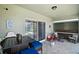 Inviting screened-in lanai with comfortable seating and tiled floor at 54 Andora Ct, Kissimmee, FL 34758