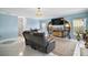Living room showcasing modern shelving, a TV, and a comfortable sofa at 54 Andora Ct, Kissimmee, FL 34758
