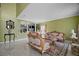 Elegant living room features decorative sofas, a patterned rug, and neutral walls at 54 Andora Ct, Kissimmee, FL 34758