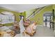 Open living space with staircase access, natural light, and stylish furnishings at 54 Andora Ct, Kissimmee, FL 34758