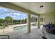 Relaxing outdoor space features an enclosed pool and an open, shaded seating area at 54 Andora Ct, Kissimmee, FL 34758