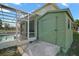 View of the pool area with shed for storing pool equipment or garden tools at 54 Andora Ct, Kissimmee, FL 34758