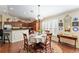 Cozy dining area adjacent to the kitchen, showcasing plantation shutters and decorative details at 648 Mission Hills Trl, The Villages, FL 32162