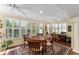 Open dining area with natural light from the large window with plantation shutters at 648 Mission Hills Trl, The Villages, FL 32162