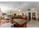 Open kitchen design with granite countertops, stainless steel appliances, and bright lighting at 648 Mission Hills Trl, The Villages, FL 32162