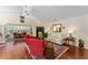 Comfortable living room with plush seating, bright lighting, and an open floor plan at 648 Mission Hills Trl, The Villages, FL 32162