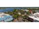 Aerial view of town center with trees, outdoor dining, and a waterway at 648 Mission Hills Trl, The Villages, FL 32162