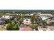 Aerial view of the city center with palm trees and outdoor parking at 648 Mission Hills Trl, The Villages, FL 32162