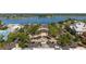 Aerial shot of the town center, showing parking and trees at 648 Mission Hills Trl, The Villages, FL 32162