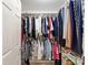Organized walk-in closet featuring shelving and hanging space for clothes and storage at 648 Mission Hills Trl, The Villages, FL 32162