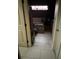 Hallway view to bathroom with soaking tub and tile floors at 6619 Ona Ct, Clermont, FL 34714