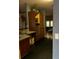 Modern kitchen with sleek black tile floors and wood cabinets at 6619 Ona Ct, Clermont, FL 34714