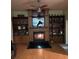 Comfortable living room with a fireplace and built in shelving at 6619 Ona Ct, Clermont, FL 34714