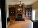 Bright living room with a fireplace and built in shelving at 6619 Ona Ct, Clermont, FL 34714