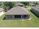 Aerial view of the backyard, patio, and roof at 6942 Sw 94Th Ct, Ocala, FL 34481