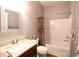 Cozy bathroom with a shower-tub combo, single sink vanity, and a floral shower curtain at 6942 Sw 94Th Ct, Ocala, FL 34481