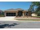 Charming single-story home with a well-manicured front yard and a two-car garage at 6942 Sw 94Th Ct, Ocala, FL 34481