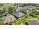 Scenic aerial view featuring the home in a well-landscaped community at 7034 Pine Hollow Dr, Mount Dora, FL 32757