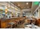 The bar and dining area features seating at the bar and tables, as well as television and multiple chairs at 7034 Pine Hollow Dr, Mount Dora, FL 32757