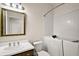 Well-lit bathroom featuring a walk-in tub, toilet, and vanity with a framed mirror at 7034 Pine Hollow Dr, Mount Dora, FL 32757