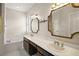 Bathroom featuring double sinks, soaking tub, and elegant fixtures at 7034 Pine Hollow Dr, Mount Dora, FL 32757