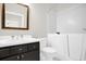 Bathroom features a soaking tub, walk in shower, white countertops, and black cabinets at 7034 Pine Hollow Dr, Mount Dora, FL 32757