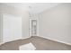 Empty bedroom with neutral paint and carpet, walk in closet and window at 7034 Pine Hollow Dr, Mount Dora, FL 32757