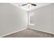 Cozy bedroom with neutral colors, carpet, and a ceiling fan at 7034 Pine Hollow Dr, Mount Dora, FL 32757