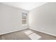 Empty bedroom features neutral paint colors, carpet, and bright sunlight at 7034 Pine Hollow Dr, Mount Dora, FL 32757
