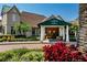 The Country Club of Mount Dora features a covered entrance with decorative wreaths and colorful landscaping at 7034 Pine Hollow Dr, Mount Dora, FL 32757