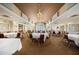The dining room provides ample seating, views of the golf course, and a chandelier at 7034 Pine Hollow Dr, Mount Dora, FL 32757