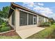 Charming screened in lanai and patio offer an inviting space for outdoor enjoyment at 7034 Pine Hollow Dr, Mount Dora, FL 32757