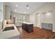 Kitchen area showcasing an island, plenty of natural light, and modern finishes at 7034 Pine Hollow Dr, Mount Dora, FL 32757