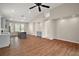 Open-concept living room with high ceilings, arched doorways and wood-look floors at 7034 Pine Hollow Dr, Mount Dora, FL 32757