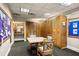 The locker room includes seating and lockers, a vanity and mirror, and bulletin boards at 7034 Pine Hollow Dr, Mount Dora, FL 32757