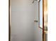 Shower stall featuring gold trim, white tile and a built-in bench at 7034 Pine Hollow Dr, Mount Dora, FL 32757