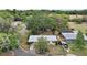 This aerial view shows the home, large trees, and the property's perimeter at 706 Michigan St, Mount Dora, FL 32757