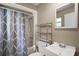 Clean bathroom with tub, shower and white sink at 706 Michigan St, Mount Dora, FL 32757