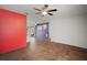 Open-concept living space with new floors, a ceiling fan, and bright, colorful accents at 706 Michigan St, Mount Dora, FL 32757