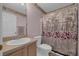 Bathroom featuring a sink, toilet, mirror, and shower with curtain, providing essential amenities at 767 Barbados Pl, The Villages, FL 32162