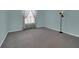Comfortable bedroom with a window and ambient lighting, creating a relaxing and serene atmosphere at 767 Barbados Pl, The Villages, FL 32162