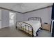 Inviting bedroom with a comfortable bed and ensuite bathroom, offering a private retreat at 767 Barbados Pl, The Villages, FL 32162
