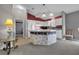 Well-designed kitchen featuring a functional island, ample counter space, and sleek white cabinetry at 767 Barbados Pl, The Villages, FL 32162