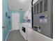 Well-lit laundry room with modern washer, dryer, and storage cabinets at 767 Barbados Pl, The Villages, FL 32162