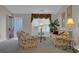 Comfortable living room with floral sofas and a bright window at 767 Barbados Pl, The Villages, FL 32162