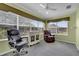Bright office with large windows, ceiling fan, and comfortable seating at 767 Barbados Pl, The Villages, FL 32162